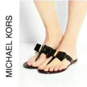 Michael Kors Kayden black bow with gold hardware jelly sandals sz 11